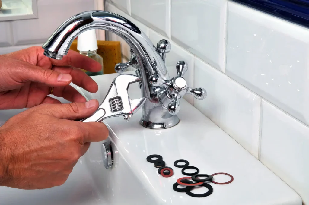 Plumber performing maintenance on a bathroom faucet in Zephyrhills