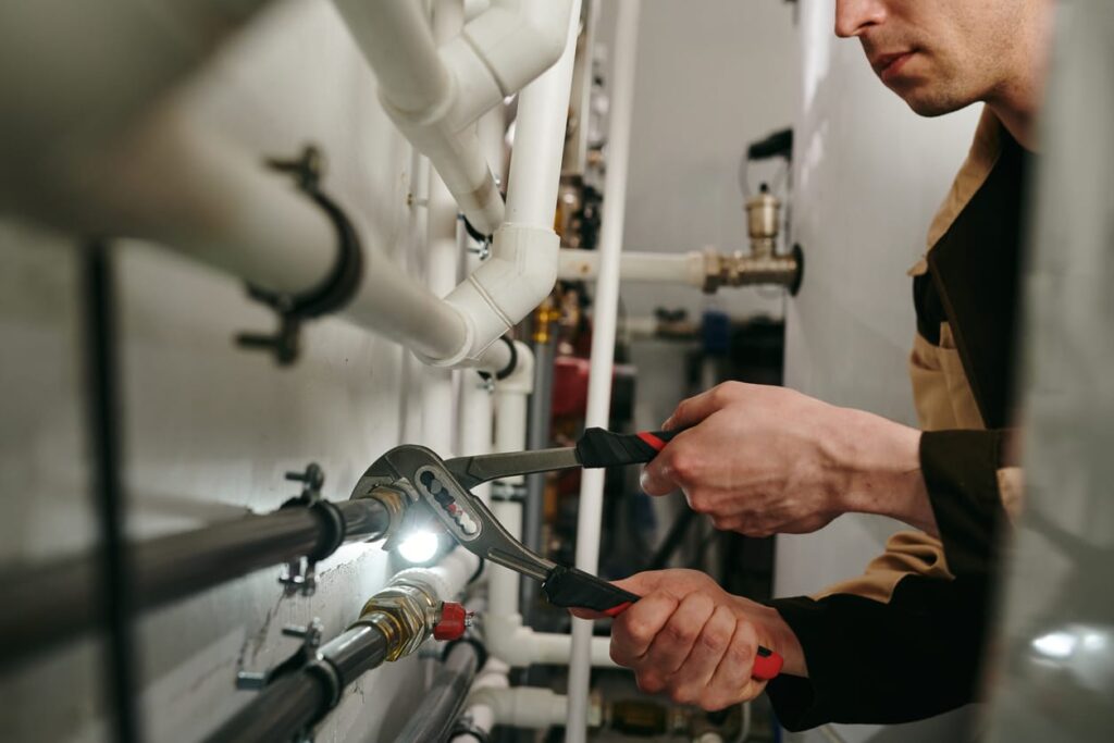 Plumbers maintaining commercial plumbing pipes in Zephyrhills