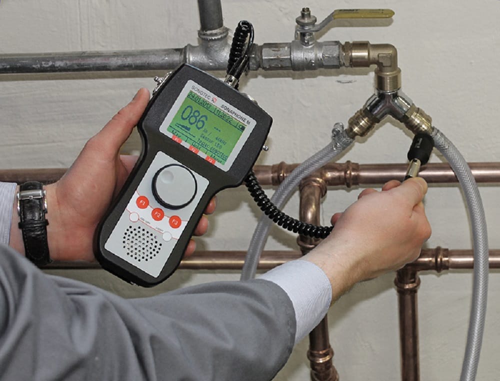 Plumber testing pipes with electronic leak detection equipment in Zephyrhills