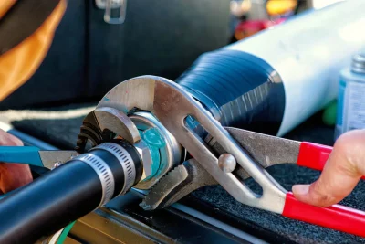Technician tightening an industrial pipe connection in Zephyrhills