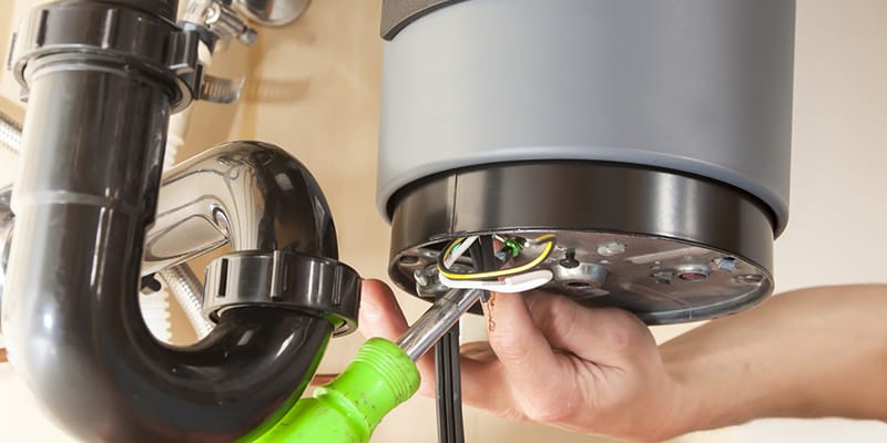 Technician repairing the heating element of a water heater in Zephyrhills