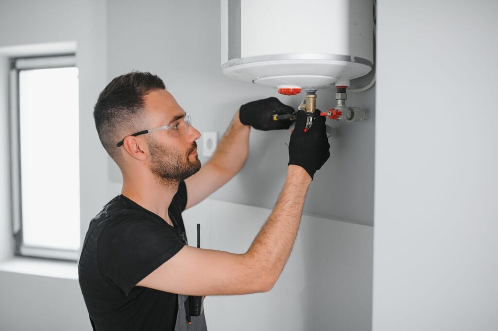 Technician performing water heater maintenance in Zephyrhills
