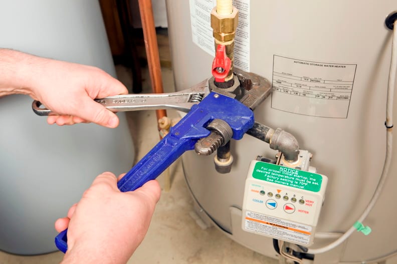 Plumber repairing a water heater valve in Zephyrhills